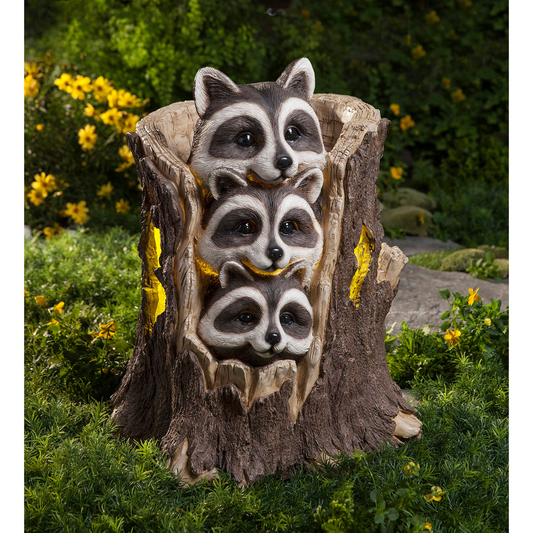 Three Raccoons in a Stump Solar Sculpture